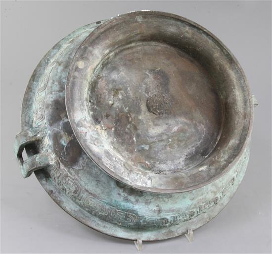 A Chinese archaic bronze ritual water basin, Pan, early Eastern Zhou dynasty, 8th-7th century B.C., 15cm high, 40.5cm, old repairs